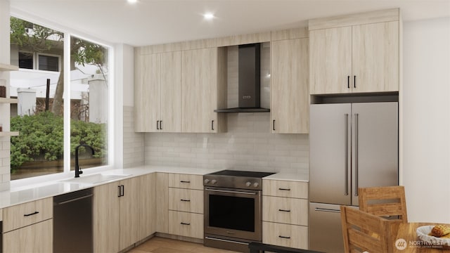 3425 Albion Pl N, Seattle, WA 98103 - kitchen featuring light brown cabinets, wall chimney range hood, high quality appliances, light countertops, and modern cabinets