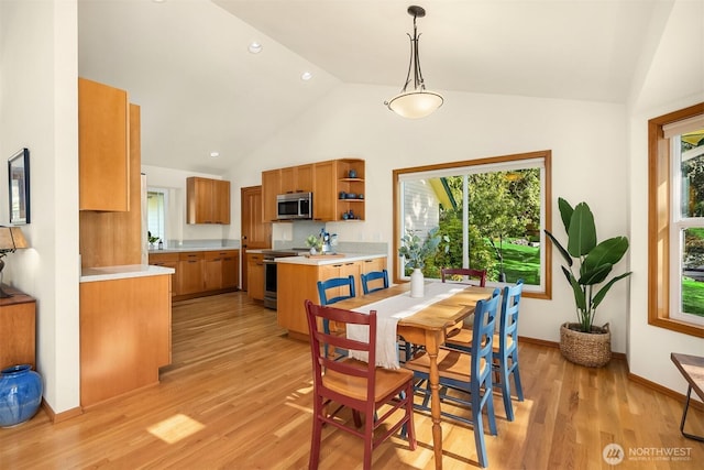 115 Quarry Rd, Port Ludlow, WA 98365 - dining area with light wood-style floors and high vaulted ceiling