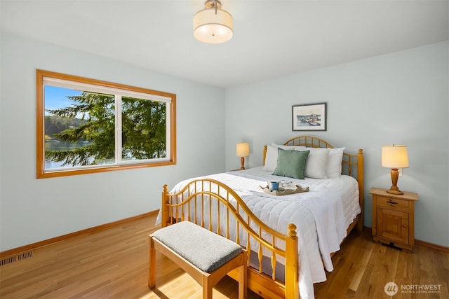 115 Quarry Rd, Port Ludlow, WA 98365 - bedroom with light wood-style flooring and baseboards