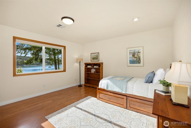 115 Quarry Rd, Port Ludlow, WA 98365 - bedroom featuring wood finished floors and baseboards