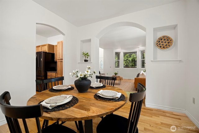 3 Spring Rd, Bellingham, WA 98229 - dining room featuring arched walkways and light wood finished floors