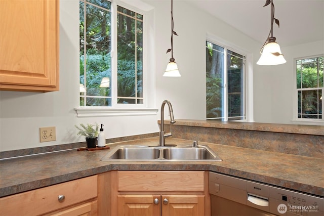 3 Spring Rd, Bellingham, WA 98229 - kitchen with stainless steel dishwasher, light brown cabinetry, dark countertops, and hanging light fixtures