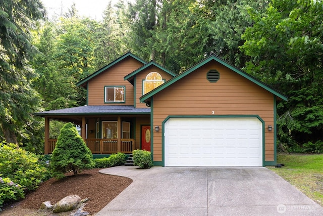 3 Spring Rd, Bellingham, WA 98229 - chalet / cabin featuring covered porch, concrete driveway, and a garage