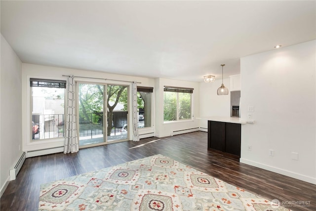 525 Lebo Blvd Unit G3, Bremerton, WA 98310 - unfurnished living room featuring a baseboard heating unit and dark wood finished floors