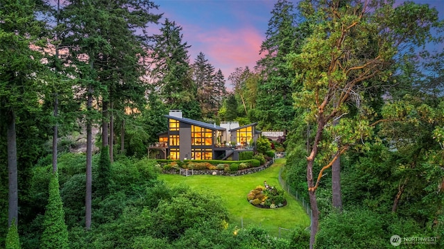 182 Island Blvd, Fox Island, WA 98333 - back of house featuring a yard, a deck, and a chimney