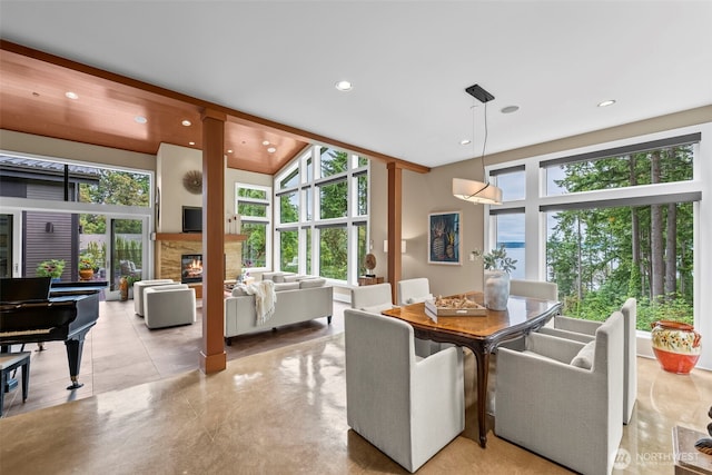 182 Island Blvd, Fox Island, WA 98333 - dining room with healthy amount of natural light, a fireplace, and recessed lighting