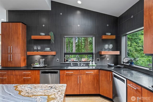 182 Island Blvd, Fox Island, WA 98333 - kitchen with stainless steel dishwasher, open shelves, vaulted ceiling, and brown cabinets