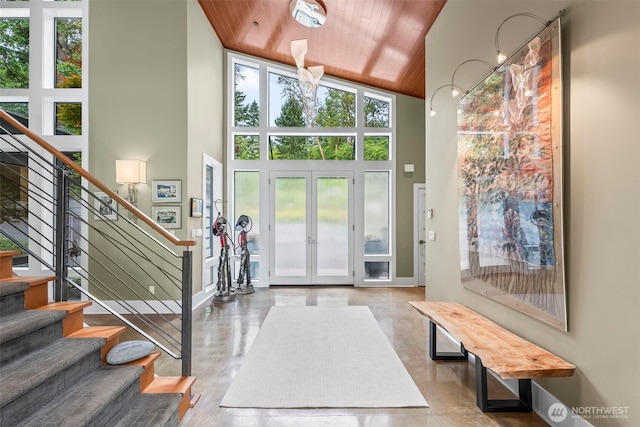 182 Island Blvd, Fox Island, WA 98333 - entrance foyer with high vaulted ceiling, wooden ceiling, stairway, and french doors