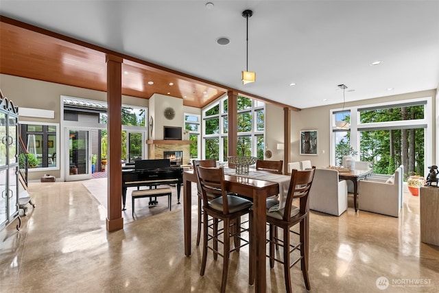 182 Island Blvd, Fox Island, WA 98333 - dining space featuring a glass covered fireplace and recessed lighting