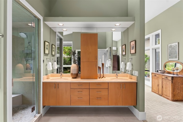 182 Island Blvd, Fox Island, WA 98333 - bathroom featuring double vanity, a shower stall, healthy amount of natural light, and tile patterned floors