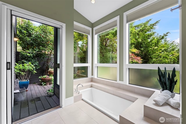 182 Island Blvd, Fox Island, WA 98333 - sunroom with plenty of natural light, vaulted ceiling, and tile patterned flooring