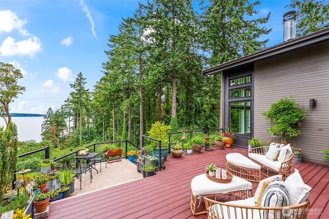 182 Island Blvd, Fox Island, WA 98333 - deck featuring a water view and an outdoor living space