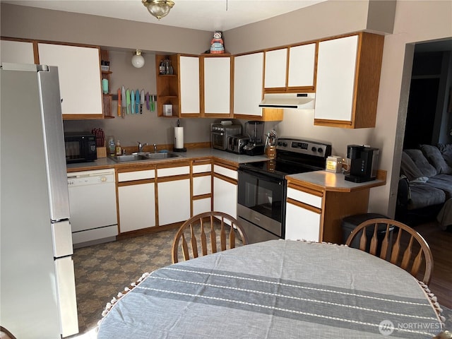 47 Pinecrest Rd, Tonasket, WA 98855 - kitchen with appliances with stainless steel finishes, under cabinet range hood, open shelves, white cabinets, and dark floors
