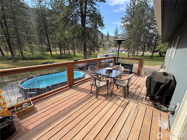 47 Pinecrest Rd, Tonasket, WA 98855 - wooden terrace with grilling area and outdoor dining space