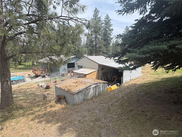47 Pinecrest Rd, Tonasket, WA 98855 - view of side of home featuring a metal roof