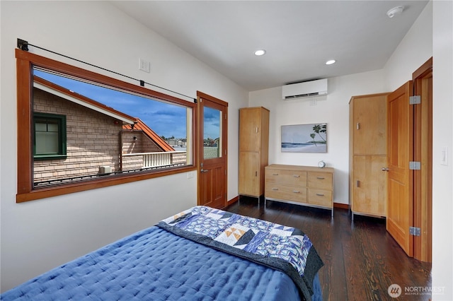 2770 Westlake Ave N Unit 6, Seattle, WA 98109 - bedroom featuring a wall unit AC, wood finished floors, and recessed lighting