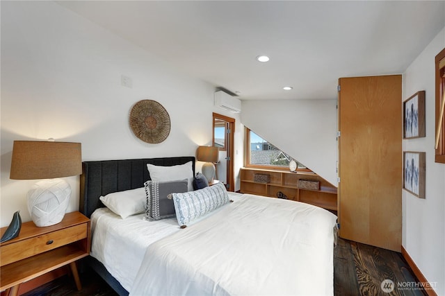 2770 Westlake Ave N Unit 6, Seattle, WA 98109 - bedroom with dark wood finished floors, an AC wall unit, and recessed lighting