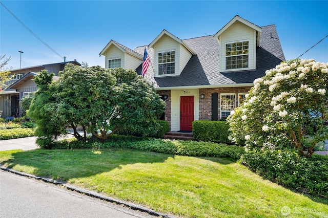 4920 Seahurst Ave, Everett, WA 98203 - view of front of property featuring roof with shingles, a front yard, and brick siding
