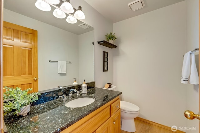 4920 Seahurst Ave, Everett, WA 98203 - half bathroom featuring toilet, wood finished floors, and vanity