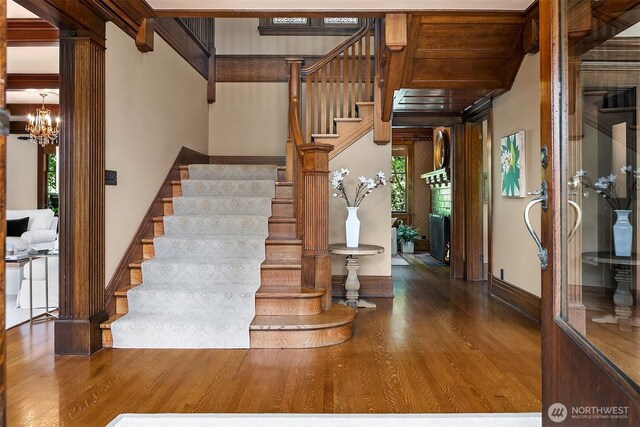 3804 S Mcclellan St, Seattle, WA 98144 - stairway with wood finished floors, plenty of natural light, and a chandelier