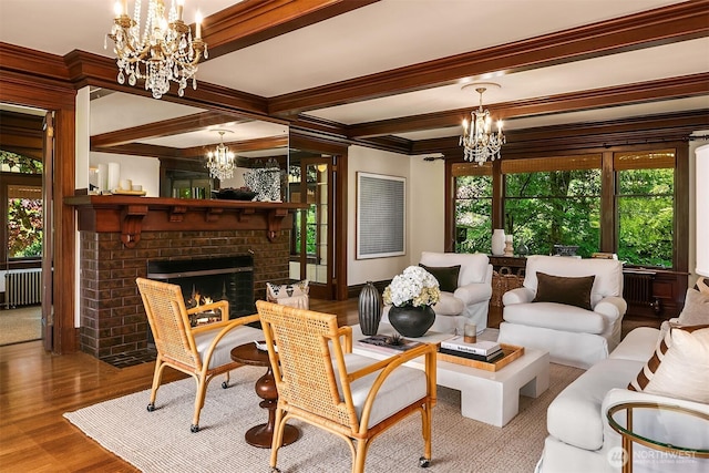 3804 S Mcclellan St, Seattle, WA 98144 - living room featuring a chandelier, radiator heating unit, healthy amount of natural light, wood finished floors, and beam ceiling