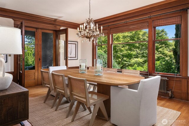 3804 S Mcclellan St, Seattle, WA 98144 - dining room with radiator heating unit, light wood-style floors, and a chandelier