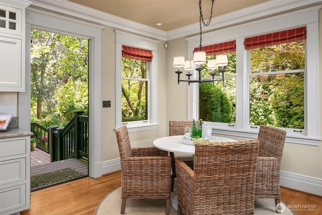 3804 S Mcclellan St, Seattle, WA 98144 - dining room featuring light wood finished floors and ornamental molding