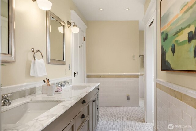 3804 S Mcclellan St, Seattle, WA 98144 - full bath with tile walls, a wainscoted wall, double vanity, tile patterned floors, and recessed lighting