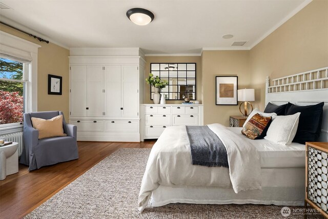 3804 S Mcclellan St, Seattle, WA 98144 - bedroom with crown molding, wood finished floors, and radiator heating unit