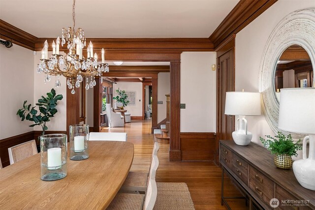 3804 S Mcclellan St, Seattle, WA 98144 - dining room featuring wood finished floors, ornamental molding, a chandelier, and wainscoting