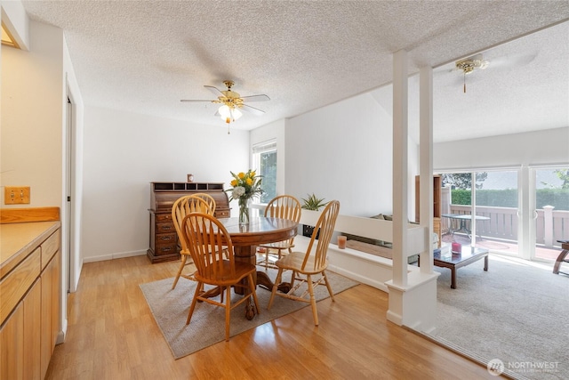 3207 SW 319th St Unit 48, Federal Way, WA 98023 - dining space with light wood-type flooring, ceiling fan, and a textured ceiling