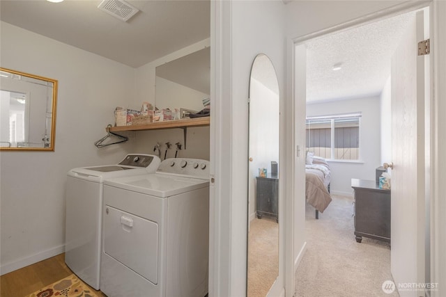 3207 SW 319th St Unit 48, Federal Way, WA 98023 - washroom featuring washer and dryer and a textured ceiling