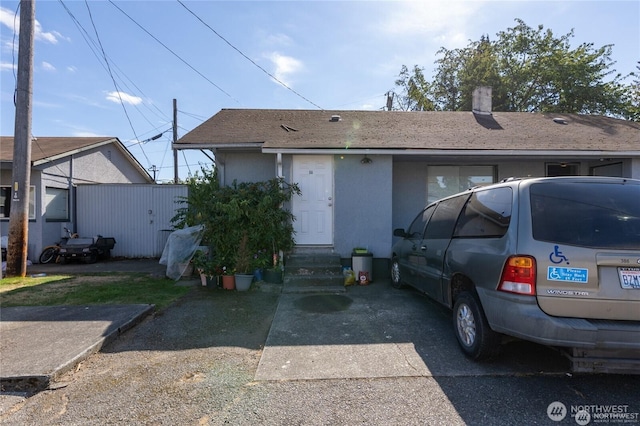 9618 Pacific Ave, Tacoma, WA 98444 - view of front of home featuring entry steps, stucco siding, and a chimney