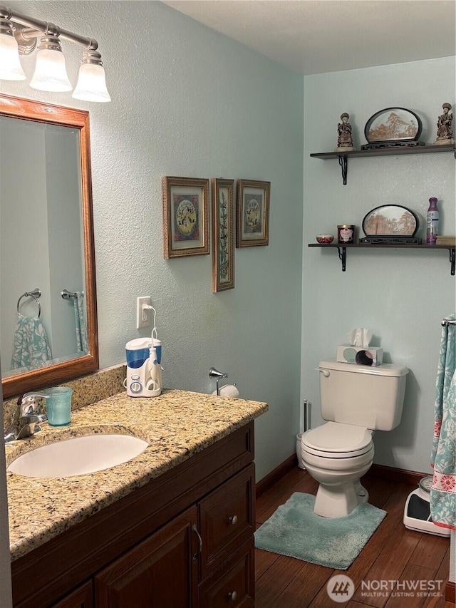 301 Main St, Riverside, WA 98849 - bathroom with hardwood / wood-style flooring and vanity