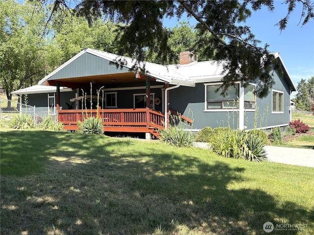 301 Main St, Riverside, WA 98849 - view of front of property featuring a front yard, a chimney, and a wooden deck