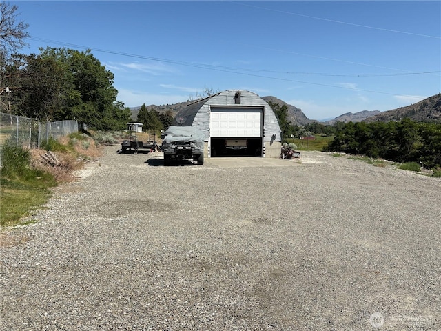 301 Main St, Riverside, WA 98849 - detached garage featuring driveway and a mountain view