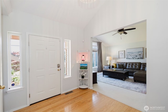 7315 E Collins Rd, Port Orchard, WA 98366 - foyer featuring wood finished floors, vaulted ceiling, and a ceiling fan
