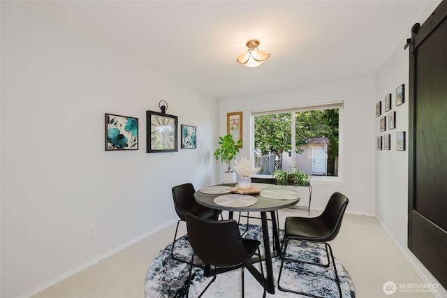 7315 E Collins Rd, Port Orchard, WA 98366 - dining room with light colored carpet and a barn door