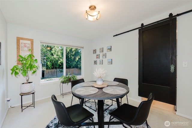 7315 E Collins Rd, Port Orchard, WA 98366 - dining space featuring a barn door and light colored carpet