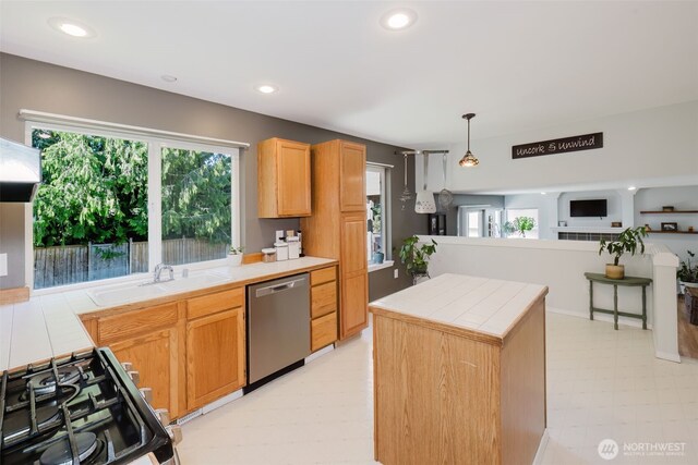 7315 E Collins Rd, Port Orchard, WA 98366 - kitchen with stainless steel dishwasher, tile countertops, range with gas cooktop, light flooring, and recessed lighting