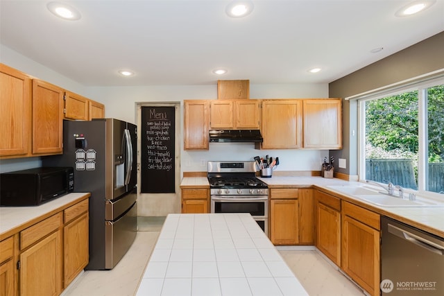 7315 E Collins Rd, Port Orchard, WA 98366 - kitchen featuring appliances with stainless steel finishes, ventilation hood, recessed lighting, and tile counters