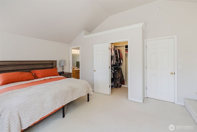7315 E Collins Rd, Port Orchard, WA 98366 - bedroom featuring lofted ceiling, a walk in closet, light carpet, a closet, and connected bathroom