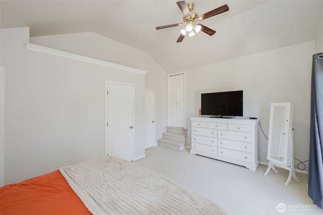 7315 E Collins Rd, Port Orchard, WA 98366 - bedroom featuring vaulted ceiling, light colored carpet, a closet, and a ceiling fan