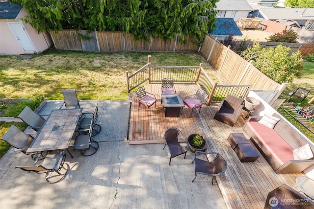 7315 E Collins Rd, Port Orchard, WA 98366 - fenced backyard with a wooden deck and a shed