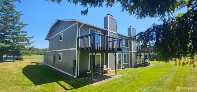 250 Charwila Ln, Enumclaw, WA 98022 - rear view of house featuring a chimney, a yard, and a wooden deck