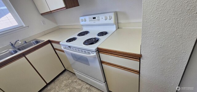 250 Charwila Ln, Enumclaw, WA 98022 - kitchen featuring white electric stove, light countertops, and white cabinets