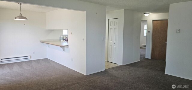 250 Charwila Ln, Enumclaw, WA 98022 - kitchen featuring a baseboard heating unit, carpet flooring, a baseboard radiator, and decorative light fixtures
