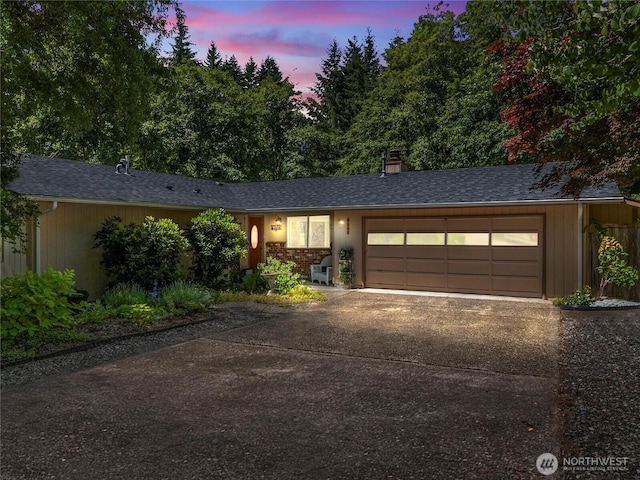 3929 Westpark Ct NW, Olympia, WA 98502 - ranch-style house with a garage, concrete driveway, roof with shingles, and a chimney