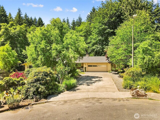 3929 Westpark Ct NW, Olympia, WA 98502 - obstructed view of property with driveway and a garage