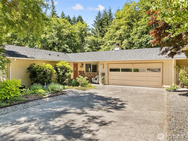 3929 Westpark Ct NW, Olympia, WA 98502 - ranch-style home featuring a garage, driveway, roof with shingles, and a chimney